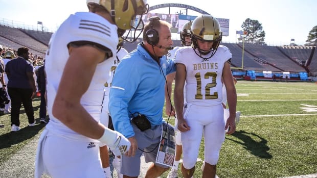 Kevin Kelley instructs his former high school team